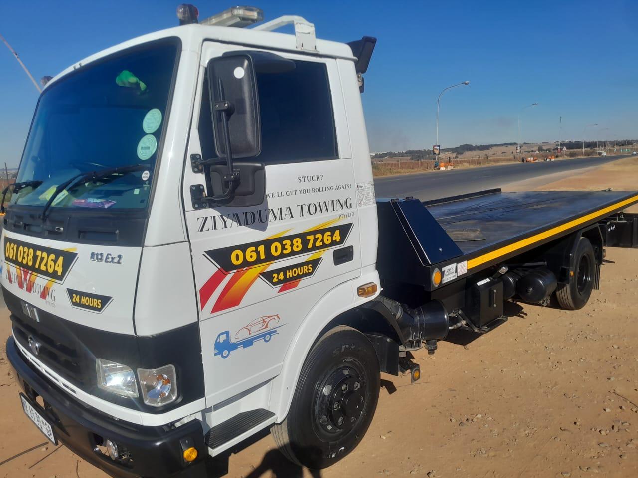 Ziyaduma Towing flatbed truck, branded with the 24-hour number 061 038 7264